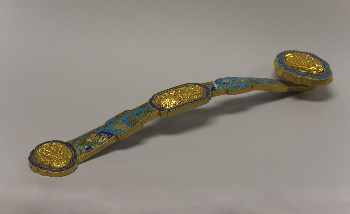 An eighteenth- to nineteenth-century cloisonné ruyi with a long curved shaft and enlarged head