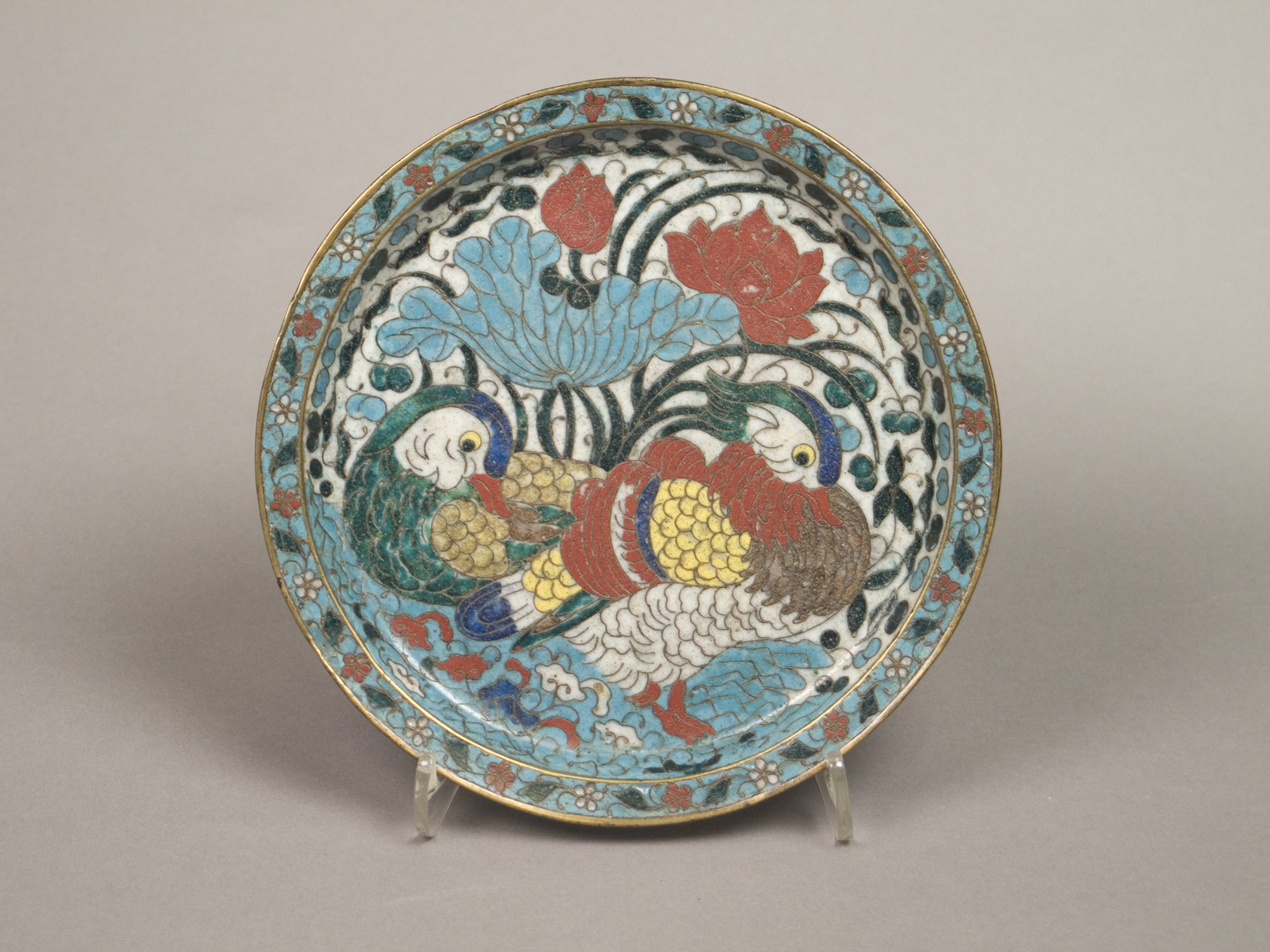 Cloisonné enamel dish with two stylized mandarin ducks among blue and red lotuses, late fifteenth to early sixteenth century
