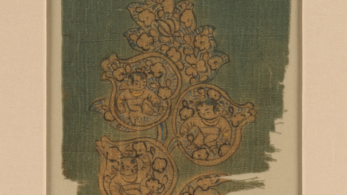 Detail of a tenth-century painted silk fragment showing boys inside pomegranates
