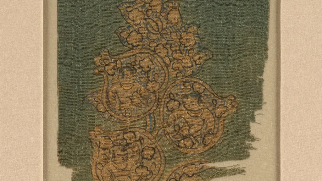 Detail of a tenth-century painted silk fragment showing boys inside pomegranates